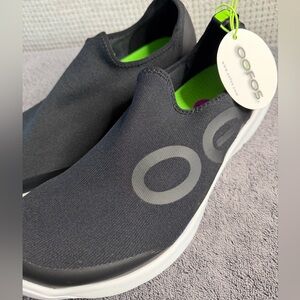 OOFOS Black and White Slip-On Shoes